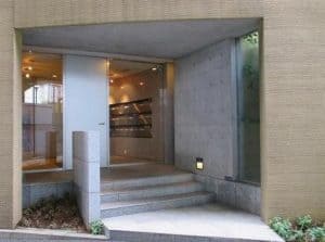 Modern clinic entrance with stairs and a.