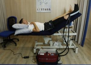 Patient undergoing spinal assessment at.