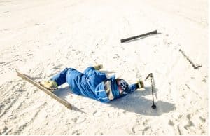 skier lying on snow
