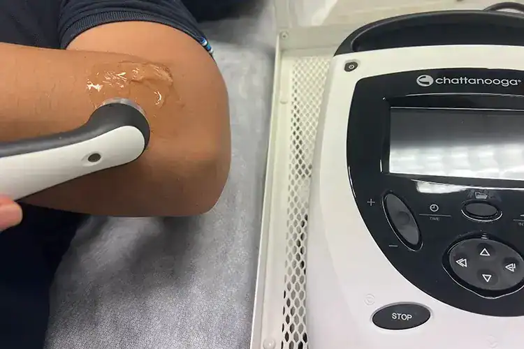 Shockwave therapy on arm at Singapore Sp.