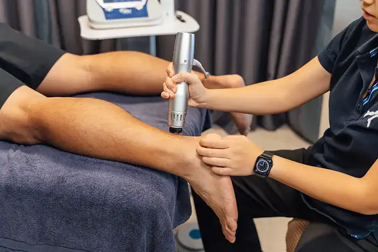 Radial shockwave therapy on ankle.